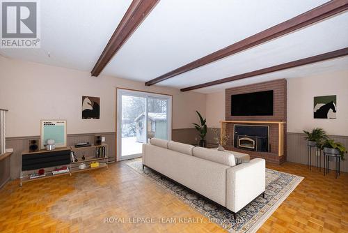 Virtually Staged - 7 Coolbrook Cr Crescent, Ottawa, ON - Indoor Photo Showing Living Room With Fireplace