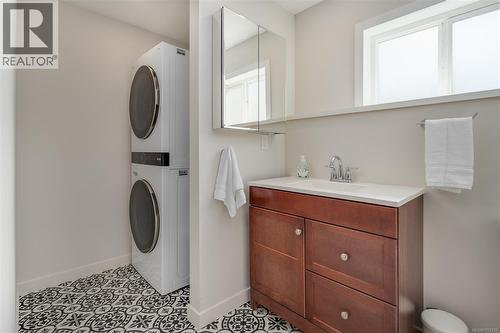 Suite's brand new bathroom with stacker washer/dryer - 10091 View St, Chemainus, BC - Indoor Photo Showing Laundry Room