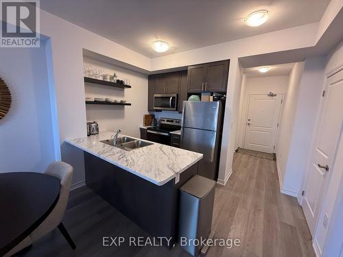606 - 460 Dundas Street E, Hamilton, ON - Indoor Photo Showing Kitchen With Double Sink