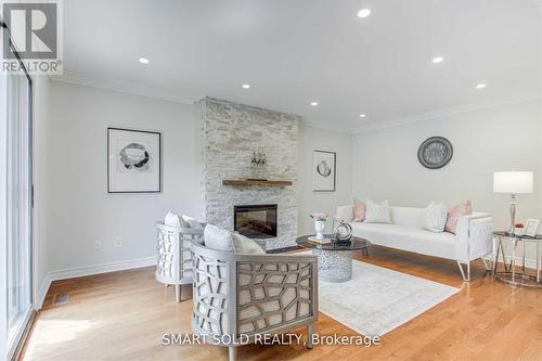 Upper Level - 45 Abbeywood Trail, Toronto, ON - Indoor Photo Showing Living Room With Fireplace