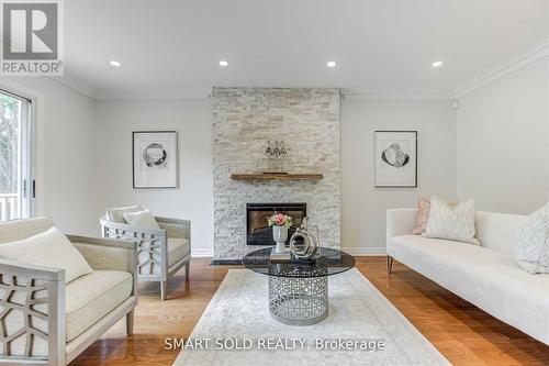 Upper Level - 45 Abbeywood Trail, Toronto, ON - Indoor Photo Showing Living Room With Fireplace