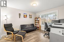 Office area with light wood-type flooring and baseboards - 