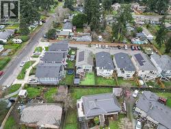 Aerial view of property and surrounding area with nearby suburban area - 