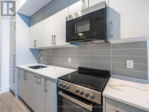 119 - 2075 King Road, King, ON - Indoor Photo Showing Kitchen With Upgraded Kitchen