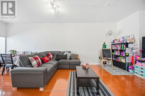 109 - 80 Alton Tower Circle, Toronto, ON - Indoor Photo Showing Living Room