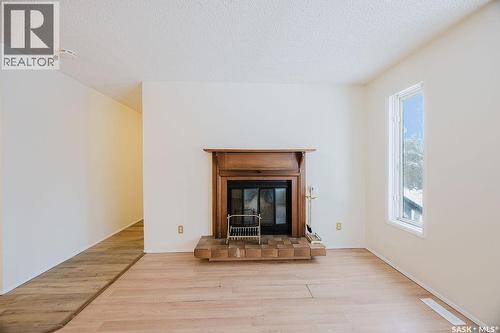 337 U Avenue S, Saskatoon, SK - Indoor Photo Showing Living Room With Fireplace