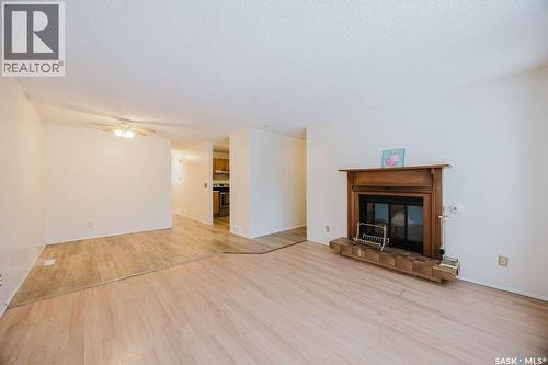 337 U Avenue S, Saskatoon, SK - Indoor Photo Showing Living Room With Fireplace