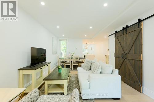Main & 2Nd - 70 Carlaw Avenue, Toronto, ON - Indoor Photo Showing Living Room