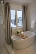 VIRTUALLY STAGED - relaxing soaker tub! - 