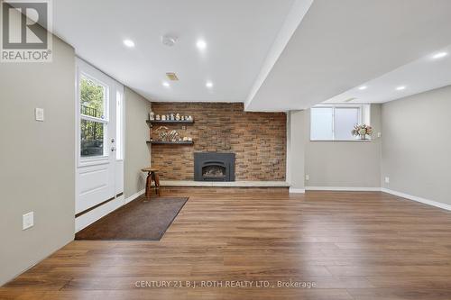 Lower level entry and fireplace - 212 Church Street, Bradford West Gwillimbury, ON - Indoor With Fireplace