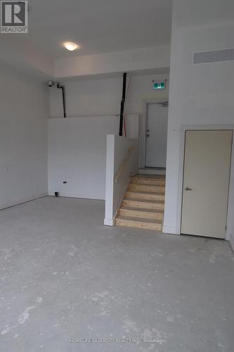 Commercial unit to be leased separately - 142 Falby Rd Road, Brampton, ON - Indoor Photo Showing Garage