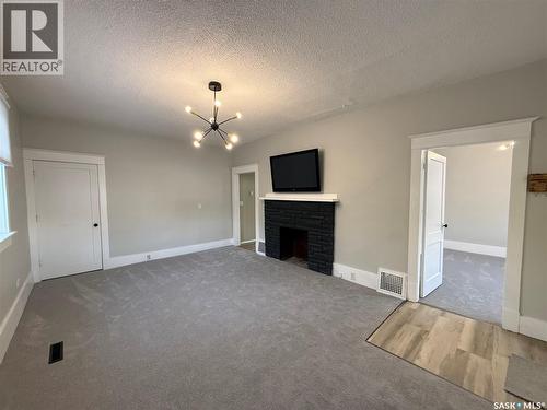 111 5Th Avenue E, Kindersley, SK - Indoor With Fireplace