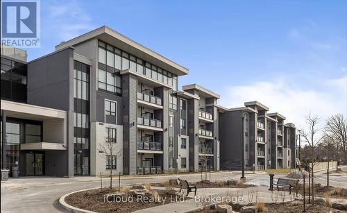 332 - 3170 Erin Mills Parkway, Mississauga, ON - Outdoor With Balcony With Facade