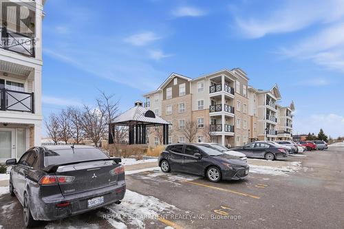 Courtyard - 107 - 1045 Nadalin Heights, Milton, ON - Outdoor With Facade
