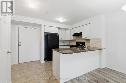 Main Entry - 107 - 1045 Nadalin Heights, Milton, ON - Indoor Photo Showing Kitchen