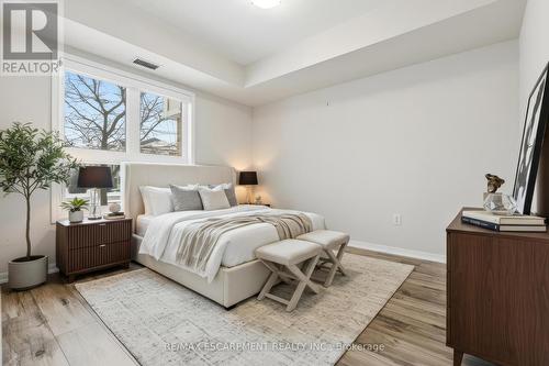 Bedroom (virtually staged) - 107 - 1045 Nadalin Heights, Milton, ON - Indoor Photo Showing Bedroom