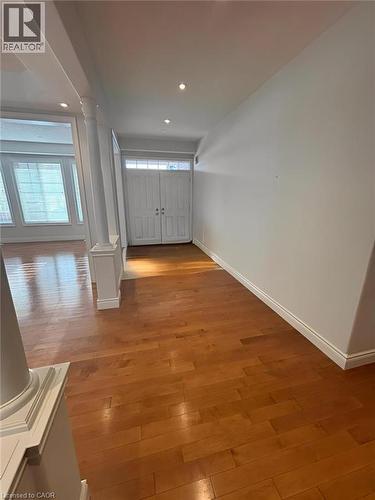 Corridor featuring light wood finished floors, recessed lighting, and ornate columns - 93 Tremaine Drive, Kitchener, ON - Indoor Photo Showing Other Room