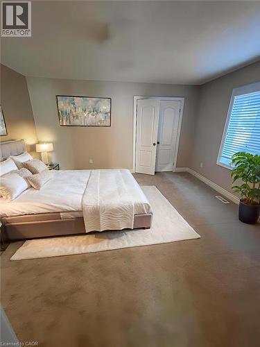Bedroom with carpet floors and baseboards - 93 Tremaine Drive, Kitchener, ON - Indoor Photo Showing Bedroom