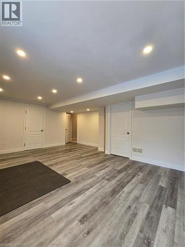 Finished below grade area with light wood-type flooring and recessed lighting - 93 Tremaine Drive, Kitchener, ON - Indoor Photo Showing Other Room