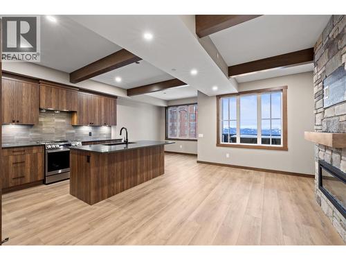 255 Feathertop Way Unit# 88, Big White, BC - Indoor Photo Showing Kitchen With Fireplace