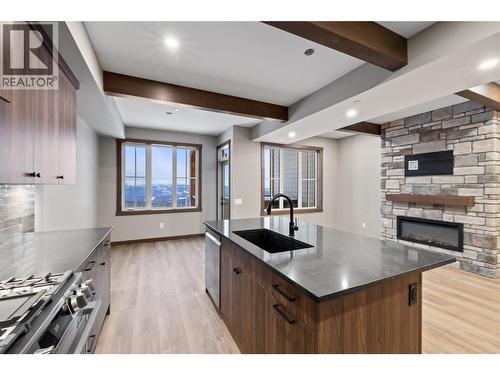 255 Feathertop Way Unit# 88, Big White, BC - Indoor Photo Showing Kitchen With Fireplace