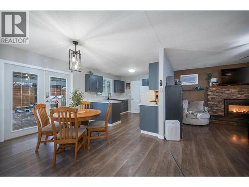 4840 Scotty Creek Road, Kelowna, BC - Indoor Photo Showing Dining Room With Fireplace