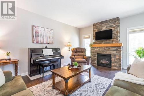 35 Parr Boulevard, Springwater, ON - Indoor Photo Showing Living Room With Fireplace