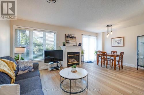 59 Bar Harbour Square, Toronto, ON - Indoor Photo Showing Living Room With Fireplace