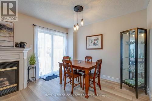 59 Bar Harbour Square, Toronto, ON - Indoor Photo Showing Dining Room With Fireplace