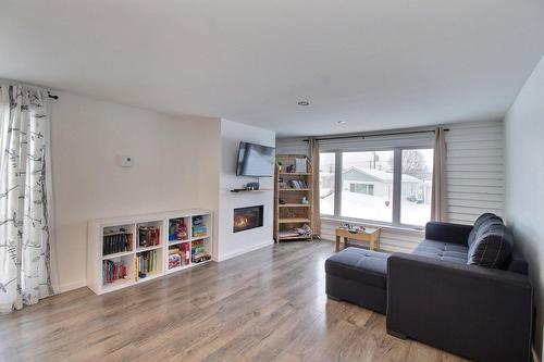 Living room - 1683 Rue Bellevue, Val-D'Or, QC - Indoor Photo Showing Living Room With Fireplace