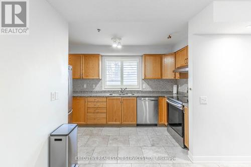 #203 - 4 Dayspring Circle, Brampton, ON - Indoor Photo Showing Kitchen With Double Sink