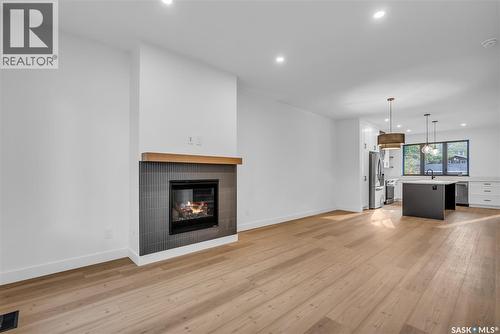 1313 Edward Avenue, Saskatoon, SK - Indoor Photo Showing Living Room With Fireplace