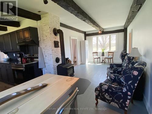 Breakfast area + cozy sitting room with wood stove - 644 County 10 Road, Prince Edward County (Hallowell Ward), ON - Indoor