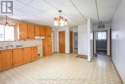 Open kitchen/dining area, showing hall to bedroom - 