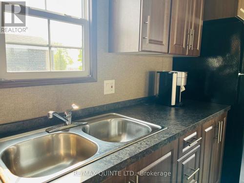 8 Cricket Ln - 486 County Road 18, Prince Edward County (Athol Ward), ON - Indoor Photo Showing Kitchen With Double Sink