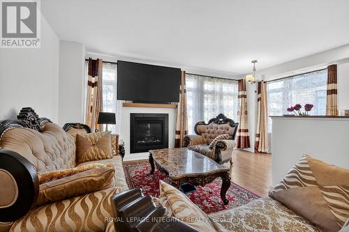2025 Allegrini Terrace, Ottawa, ON - Indoor Photo Showing Living Room With Fireplace