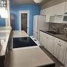17 1292 Gordon Road, Moose Jaw, SK  - Indoor Photo Showing Kitchen With Double Sink 