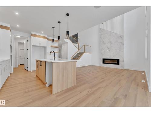 744 Astoria Wy, Devon, AB - Indoor Photo Showing Other Room With Fireplace