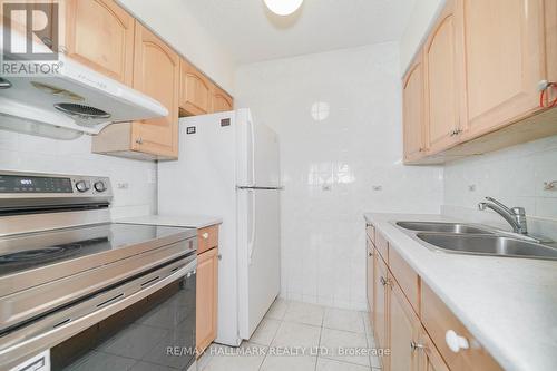 411 - 50 Lotherton Pathway, Toronto, ON - Indoor Photo Showing Kitchen With Double Sink