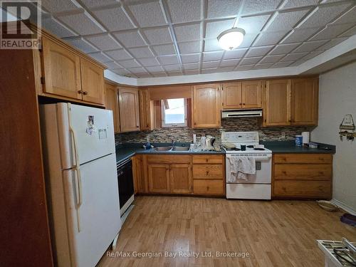 Loads Of Cupboards - 8 Mill Street, Severn (Coldwater), ON - Indoor Photo Showing Kitchen With Double Sink