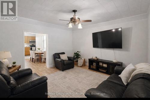 Virtually staged living room - 8 Mill Street, Severn (Coldwater), ON - Indoor Photo Showing Living Room