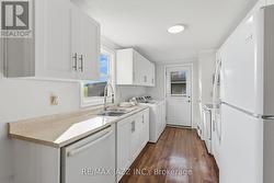 Modern White Cabinetry and Large Counter Space - 