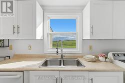 Kitchen Window Framing Scenic Lake View - 