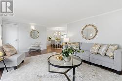 Stylish Open Living Room Overlooks Dining Area - 