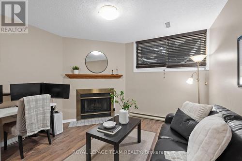 27 Sandcliffe Terrace, Ottawa, ON - Indoor Photo Showing Living Room With Fireplace