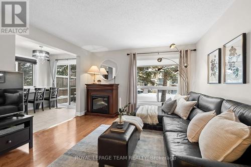 27 Sandcliffe Terrace, Ottawa, ON - Indoor Photo Showing Living Room With Fireplace