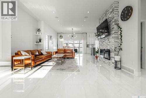 511 Burgess Crescent, Saskatoon, SK - Indoor Photo Showing Living Room With Fireplace