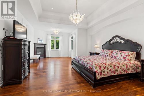 Primary bedroom w gas fireplace & WI Closet. - 1623 Claymor Avenue, Ottawa, ON - Indoor Photo Showing Bedroom