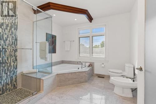 Deep soaker tub & stand alone bidet. - 1623 Claymor Avenue, Ottawa, ON - Indoor Photo Showing Bathroom