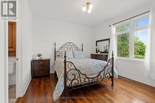 Bedroom w closet & fixture above. - 1623 Claymor Avenue, Ottawa, ON - Indoor Photo Showing Bedroom